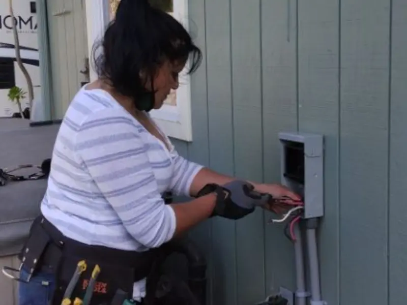 Licensed electrician wiring an exterior subpanel in Sonoma